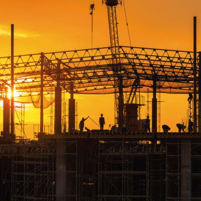 Workers busy operate at Construction site in beginning of buildi