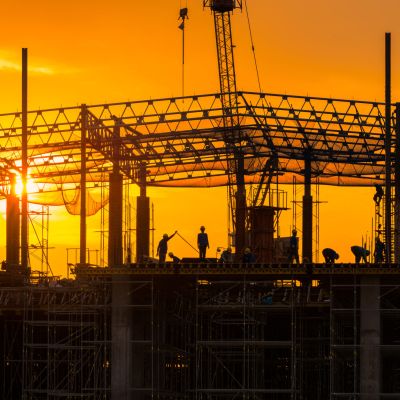 Workers busy operate at Construction site in beginning of buildi