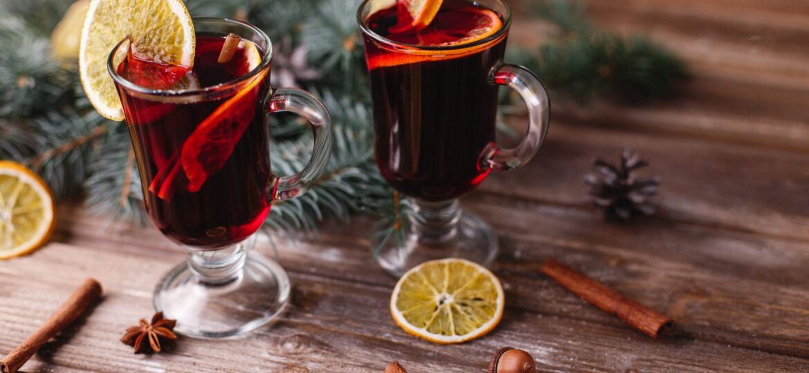 Christmas and New Year decor. Two cups of mulled wine with orang