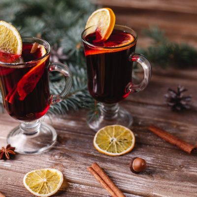 Christmas and New Year decor. Two cups of mulled wine with orang