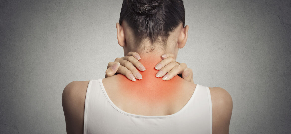 Back spine disease. Closeup view tired female massaging her neck