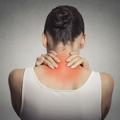 Back spine disease. Closeup view tired female massaging her neck