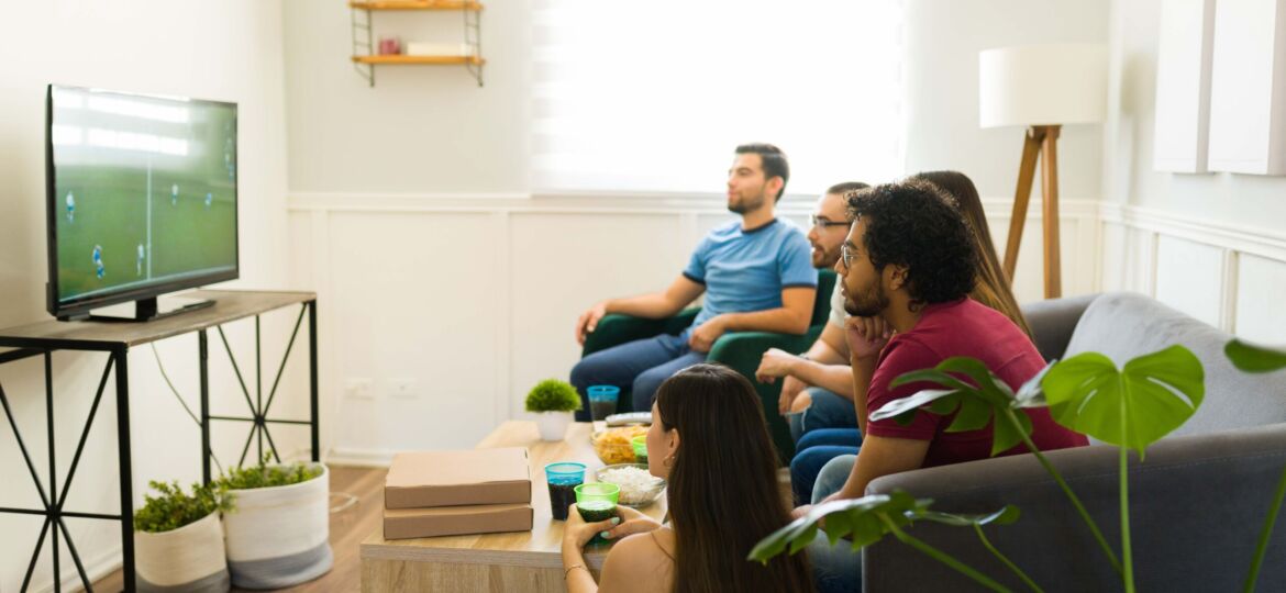 Side,View,Of,A,Hispanic,Sports,Fans,Watching,The,Soccer